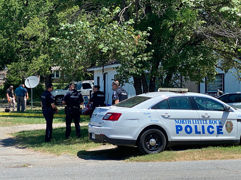 The North Little Rock Police Department investigates a homicide Wednesday morning on W. 22nd St. in North Little Rock. (Arkansas-Democrat Gazette/Staci Vandagriff)