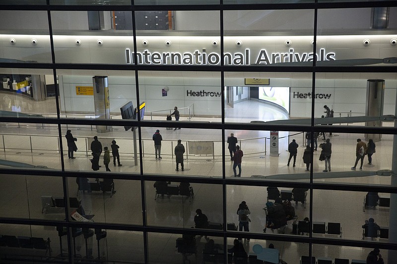 People mill about the arrivals area at Heathrow Airport in London, during England’s coronavirus lockdown in January.
(AP)