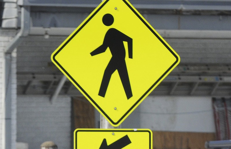 FILE — A pedestrian crossing sign is shown in this 2011 file photo. (NWA Democrat-Gazette file photo)