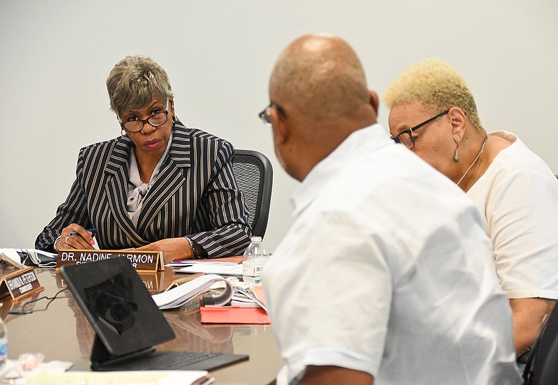 FILE — (From left) Nadine Jarmon, executive director of the Metropolitan Housing Alliance, commissioner Leta Anthony and commissioner H. Lee Lindsey have a discussion during the Metropolitan Housing Alliance meeting in Little Rock in this Thursday, June 17, file photo. (Arkansas Democrat-Gazette/Staci Vandagriff)