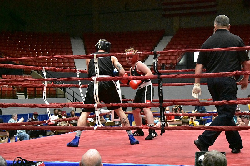 Two fighters compete June 5 in the Arkansas State Silver Gloves championships at the Pine Bluff Convention Center. The Region 6 Silver Gloves championships have been moved from Pine Bluff to Searcy. 
(Pine Bluff Commercial/I.C. Murrell)