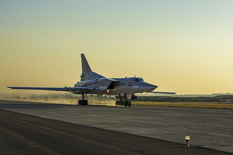 A Tu-22M3 bomber of the Russian air force takes off from Hemeimeem air base in Syria as Russia’s  military was carrying out maneuvers Friday in the Mediterranean Sea.
(AP/Russian Defense Ministry Press Service)