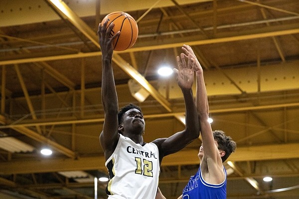 Little Rock Central’s Annor Boateng, a 6-5 forward, attempts a shot around the rim during a game against Bryant.