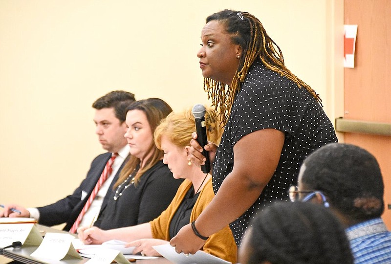 Ebony Russ, a Department of Human Services program manager, announces the next agenda item during the meeting Thursday, June 24, 2021 at the Department of Human Services in Little Rock.
(Arkansas Democrat-Gazette/Staci Vandagriff)