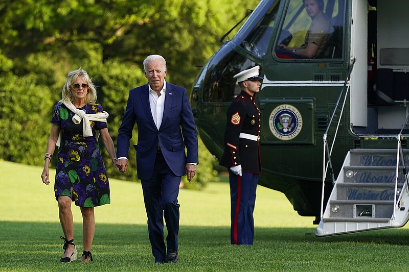 President Joe Biden and first lady Jill Biden walk on the South Lawn of the White House after stepping off Marine One, Sunday, June 27, 2021, in Washington. (AP/Patrick Semansky)
