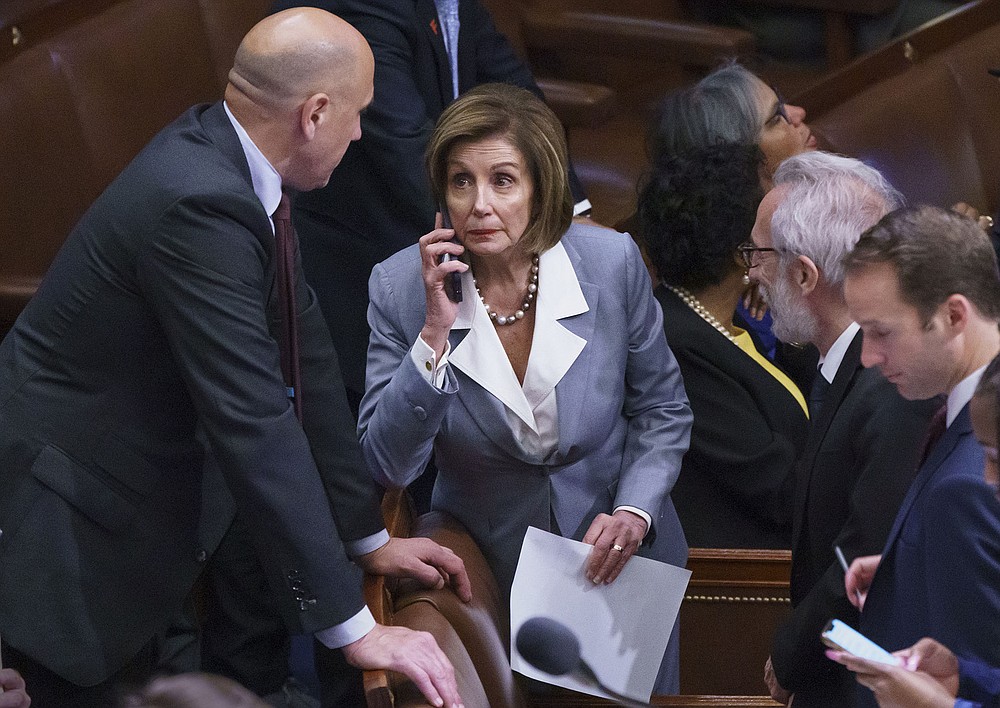 House Speaker Nancy Pelosi manages the vote Wednesday on the House floor on a measure to create a select committee to investigate the Jan. 6 riot at the Capitol. “We will be judged by future generations as to how we value our democracy,” Pelosi told colleagues before the vote.
(AP/J. Scott Applewhite)