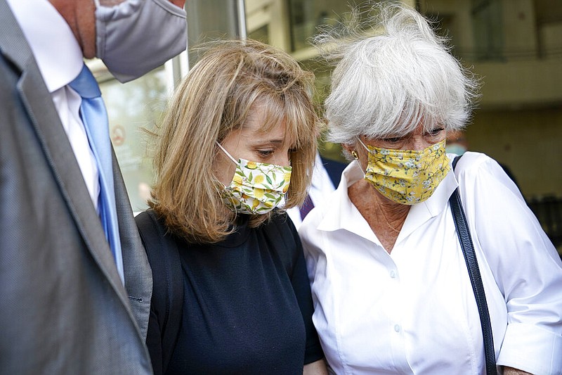 Allison Mack (center) leaves federal court with her mother, Mindy Mack, after being sentenced Wednesday, June 30, 2021, in New York. The "Smallville" actor was sentenced to three years in prison for her role in the cult-like NXIVM group. (AP/Mary Altaffer)