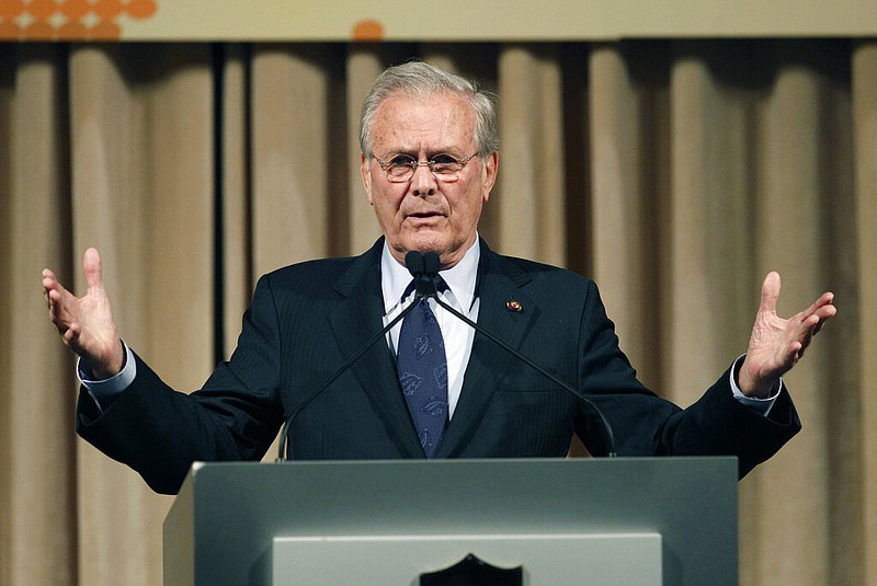 Former U.S. Defense Secretary Donald Rumsfeld speaks to politicians and academics during a luncheon in Taipei, Taiwan, in this Oct. 11, 2011, file photo. (AP/Wally Santana)