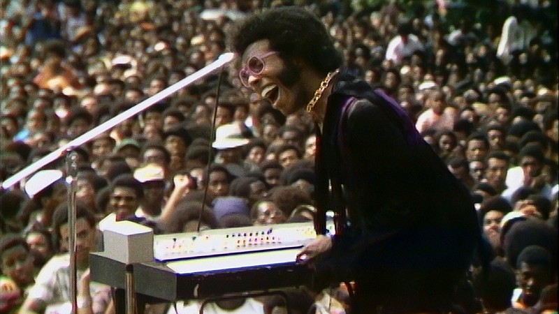 There’s a Riot Goin’ On: Sly Stone performs in front of an estimated 300,000 people at the 1969 Harlem Cultural Festival, a moment that was obscured by the moon landing and the Woodstock Festival and was nearly lost to the ages.