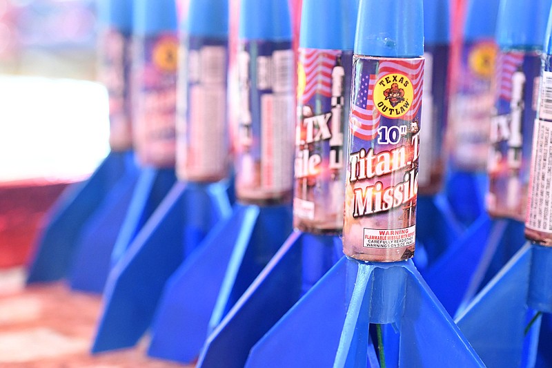 Fireworks are displayed Sunday June 27, 2021 at the Stewart Family Fireworks tent on Joyce Blvd in Fayetteville. The family has two fireworks tents in Fayetteville. Fireworks are allowed to be used in Fayetteville from 10 a.m. to 10 p.m. on July 1-3 and from 10 a.m. to 11 p.m. July 4. Visit nwaonline.com/2100628Daily/ and nwadg.com/photo. (NWA Democrat-Gazette/J.T. Wampler)