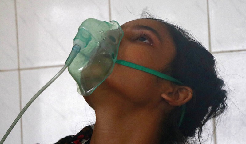 A patient receives oxygen at the Medical College Hospital in Rajshahi, Bangladesh, 158 miles north of the capital, Dhaka, in this June 16, 2021, file photo. As of mid-June, Rajshahi had become one of the latest hotspots for the deadlier delta variant of the coronavirus. (AP/Kabir Tuhin)