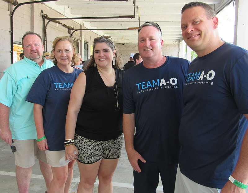 Michael and Alyson Almond, Annette LaRue, Todd Reddell and Chris Frisbie on 06/13/21 at Baggo, Brats and Blues, The Rail Yard (Arkansas Democrat-Gazette/Kimberly Dishongh)