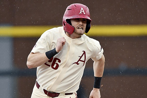 Arkansas' Ethan Bates runs the bases during a game against Southeast Missouri State on Sunday, Feb. 28, 2021, in Fayetteville. (AP Photo/Michael Woods)