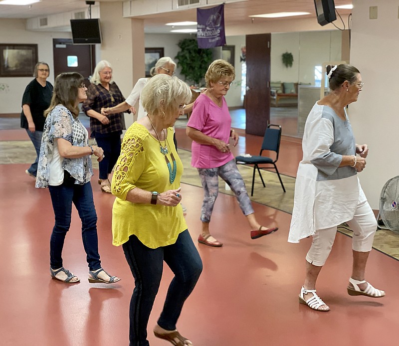 Seniors participated in a dance class Tuesday morning at the Champagnolle Landing Senior Wellness Center as it reopened after over a year of being closed due to the COVID-19 pandemic. (Marvin Richards/News-Times)