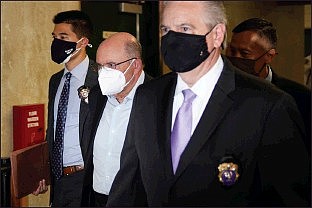 The Trump Organization’s Chief Financial Officer Allen Weisselberg, second from left, arrives to a courtroom in New York, Thursday, July 1, 2021. Donald Trump’s company and its longtime finance chief were charged Thursday in what a prosecutor called a “sweeping and audacious” tax fraud scheme that saw the Trump executive allegedly receive more than $1.7 million in off-the-books compensation, including apartment rent, car payments and school tuition.(AP Photo/Seth Wenig)