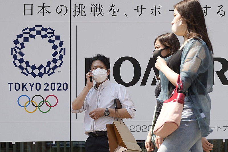 The Tokyo Olympics, scheduled to begin July 23, will now be a mostly TV-only event after officials announced Thursday that fans will not be allowed to attend events in the city’s arenas and stadiums after the Japanese government placed the city under a covid-19 state of emergency.
(AP/Shuji Kajiyama)