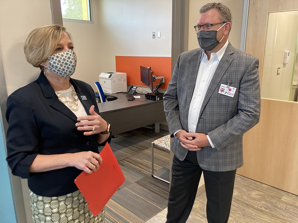 Marcy Doderer, president and CEO of Arkansas Children’s Hospital, and Brian Thomas, president and CEO of Jefferson Regional Medical Center, visit Friday during a walk through of the new facility. 
(Pine Bluff Commercial/Byron Tate)