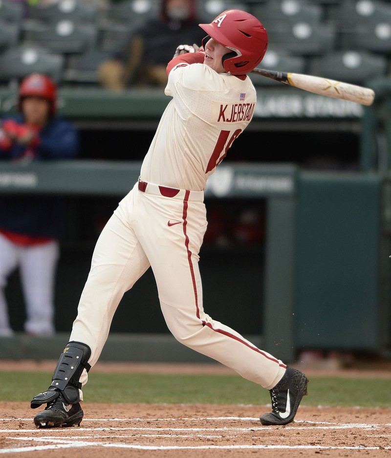 NWA Democrat-Gazette/ANDY SHUPE.Arkansas right fielder Heston Kjerstad connects for a run-scoring double to score Casey Martin against Stony Brook Saturday, March 2, 2019, during the first inning at Baum-Walker Stadium in Fayetteville. Visit nwadg.com/photos to see more photographs from the game.