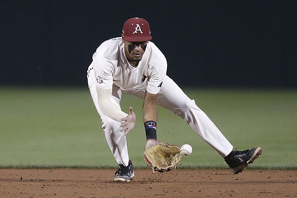 Arkansas shortstop Jalen Battles (4) fields a ball during an NCAA regional game against Nebraska on Sunday, June 6, 2021, in Fayetteville.