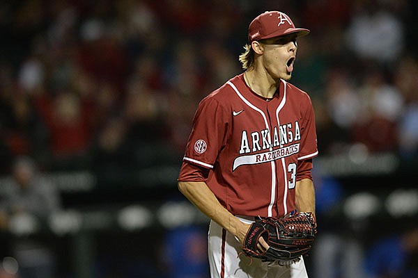 Arkansas reliever Caden Monke celebrates Friday, May 21, 2021, after recording the final out of the top of the eighth inning of play against Florida at Baum-Walker Stadium in Fayetteville.