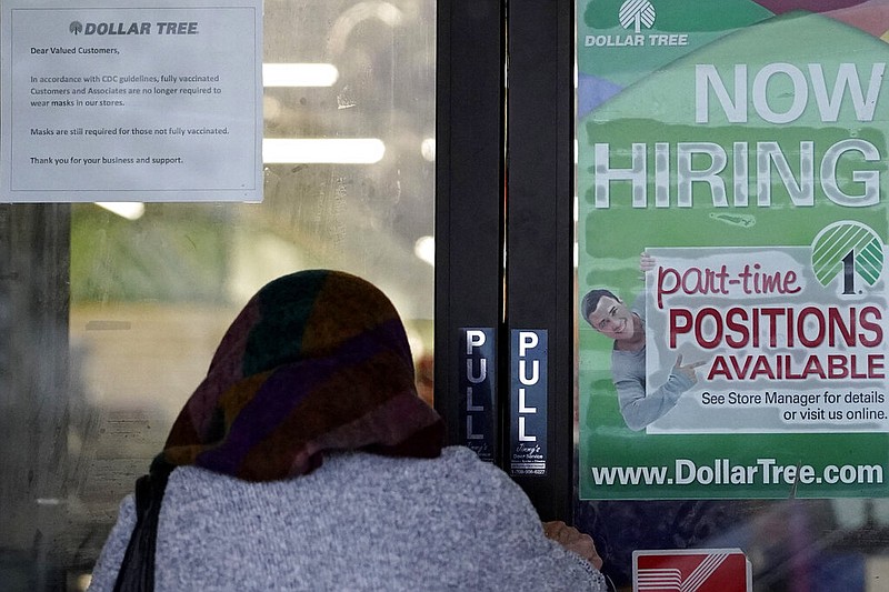 A shopper enters a retail store in Buffalo Grove, Ill., with a hiring sign on the door in this June 24, 2021, file photo. (AP/Nam Y. Huh)