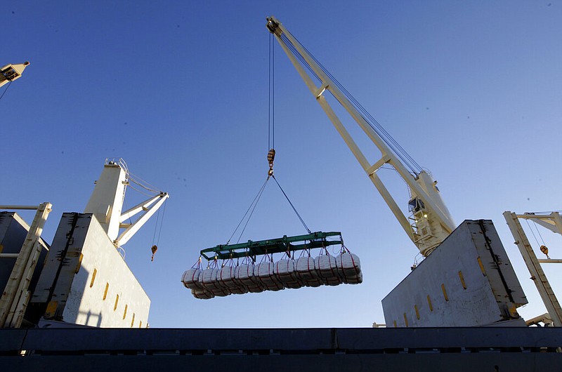 Rice bound for Japan is loaded aboard a ship at the Port of Sacramento in West Sacramento, Calif., in this Nov. 23, 2012, file photo. (AP/Rich Pedroncelli)