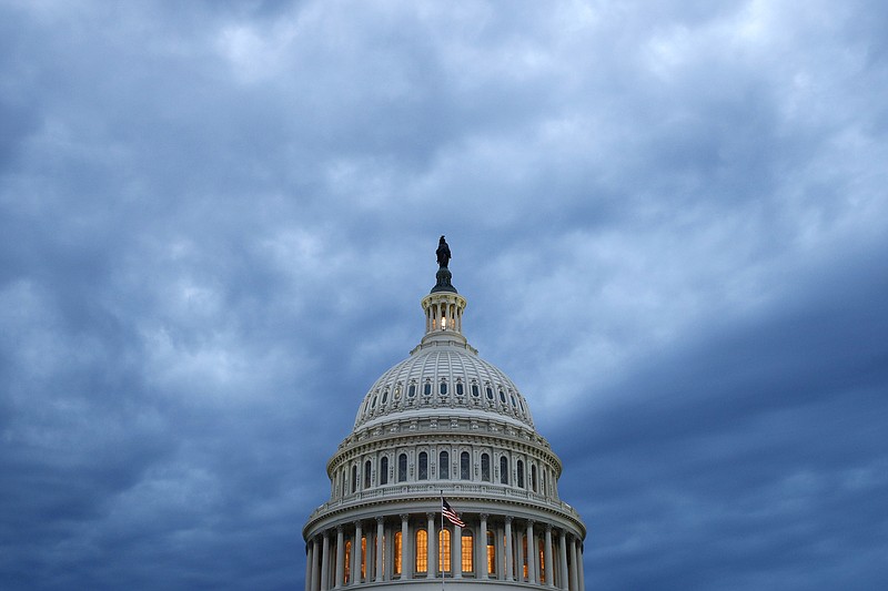 FILE - In this June 12, 2019, file photo, clouds roll over the U.S. Capitol dome as dusk approaches in Washington. (AP/Patrick Semansky, File)