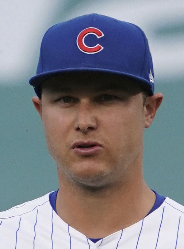 Chicago Cubs left fielder Joc Pederson (24) holds up his World