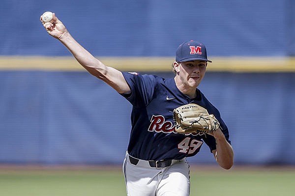 Ole Miss pitcher Cody Adcock pitches against Arkansas in the first inning of an NCAA college baseball game during the SEC Tournament on Saturday, May 29, 2021, in Hoover, Ala. (AP Photo/Butch Dill)
