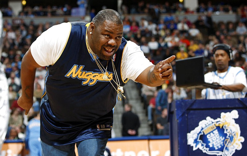 Biz Markie performs for fans during halftime of the Denver Nuggets' 105-99 victory over the Phoenix Suns in an NBA game in Denver in this Dec. 12, 2009, file photo. Markie’s representative, Jenni Izumi, said in a statement that the rapper-DJ died peacefully Friday, July 16, 2021, with his wife by his side. No cause of death was released. Biz Markie was 57. (AP/David Zalubowski)