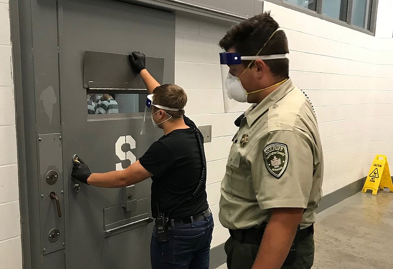 Deputy First Class Robbie Phipps and Detention Officer Zachary Newman inside the Washington County Detention Center. (Courtesy Photo/WASHINGTON COUNTY SHERIFF'S OFFICE).