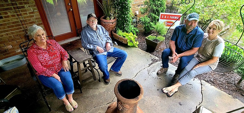 Stefan and Lynn Draper of S&L Farms (right) were named the 2021 Jefferson County Farm Family of the year. The couple took over the farm from Lynn’s parents, Jim and Judy Parker, who started raising chicks in 1985 after Jim retired from the Pine Bluff Police Department. 
(Pine Bluff Commercial/Eplunus Colvin)