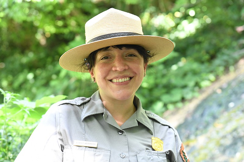 Ashley Waymouth, Hot Springs National Park Ranger, stands near the cascade next to Arlington Lawn. Photo by Tanner Newton of The Sentinel-Record