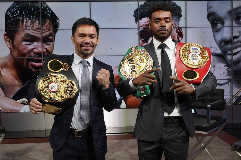 Manny Pacquiao, left, and Errol Spence Jr., pose for a photo at a news conference at the Fox Studios lot in Los Angeles ahead of their upcoming boxing match, taking place in Las Vegas on Aug. 21, in Los Angeles. (AP Photo/Damian Dovarganes)