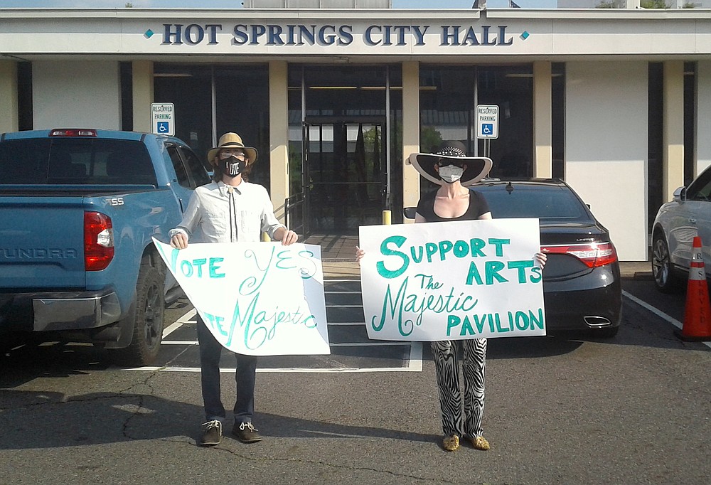 Ben Droz, left, and Rie Schaffer show their support for The Majestic project Tuesday at City Hall. - Photo by David Showers of The Sentinel-Record