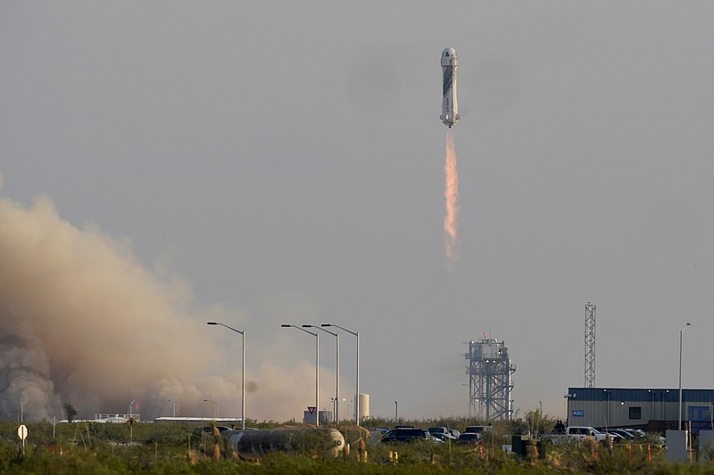 Blue Origin's New Shepard rocket launches carrying passengers Jeff Bezos, founder of Amazon and space tourism company Blue Origin, brother Mark Bezos, Oliver Daemen and Wally Funk, from its spaceport near Van Horn, Texas, Tuesday, July 20, 2021. (AP/Tony Gutierrez)