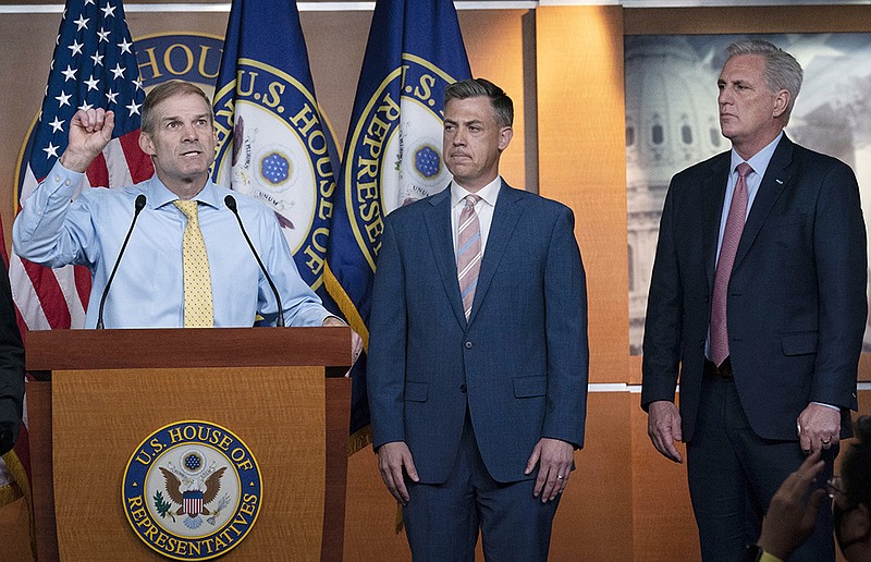 Rep. Jim Jordan (from left), Rep. Jim Banks and House Minority Leader Kevin McCarthy hold a news conference Wednesday. McCarthy slammed House Speaker Nancy Pelosi for “an egregious abuse of power” for refusing to allow Jordan and Banks, who voted against certifying the election of President Joe Biden on Jan. 6, to sit on the select committee. More photos at arkansasonline.com/722gop/.
(AP/Jose Luis Magana)