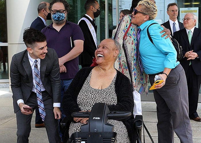 American Civil Liberties Union attorney Chase Strangio (left) celebrates with veteran transgender rights activist Miss Major Griffin-Gracy outside the federal courthouse in Little Rock after Wednesday’s ruling. More photos at arkansasonline.com/722trans/.
(Arkansas Democrat-Gazette/Thomas Metthe)