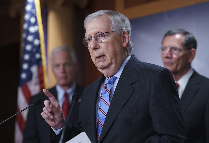 Senate Minority Leader Mitch McConnell and other GOP senators speak to reporters Wednesday ahead of a test vote scheduled by Democratic Leader Chuck Schumer on the infrastructure deal that senators brokered with President Joe Biden. Video at arkansasonline.com/722mcconnell/.
(AP/J. Scott Applewhite)