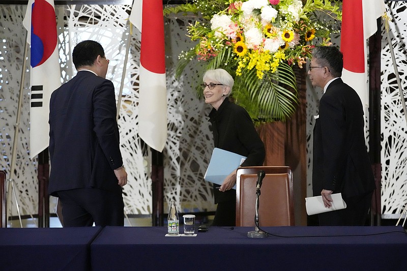 South Korean First Vice Foreign Minister Choi Jong Kun (from left), U.S. Deputy Secretary of State Wendy Sherman and Japanese Vice Minister for Foreign Affairs Takeo Mori wrap up a news conference on their trilateral meeting Wednesday in Tokyo.
(AP/Eugene Hoshiko)
