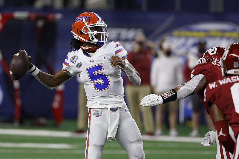 Florida quarterback Emory Jones (5) throws a pass in the first half of the Cotton Bowl NCAA college football game against Oklahoma in Arlington, Texas, Wednesday, Dec. 30, 2020. (AP Photo/Ron Jenkins)