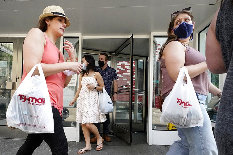 Shoppers exit a retail store in downtown Chicago in this May 22, 2021, file photo. (AP/Nam Y. Huh)