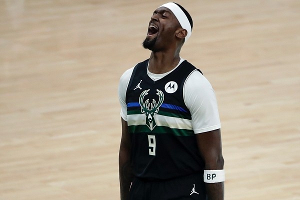 Milwaukee Bucks center Bobby Portis (9) reacts during the first half of Game 6 of basketball's NBA Finals against the Phoenix Suns Tuesday, July 20, 2021, in Milwaukee. (AP Photo/Aaron Gash)