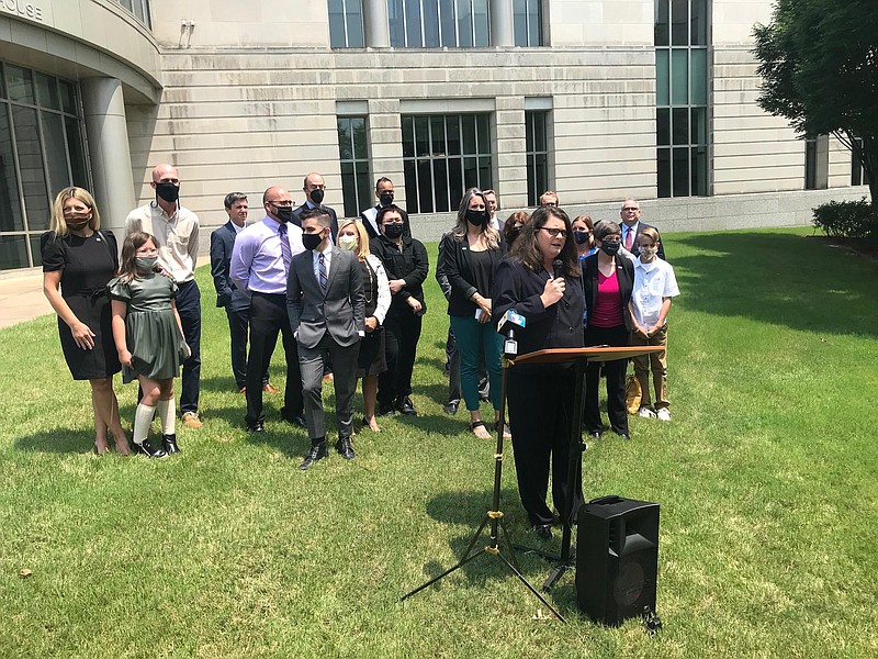 Holly Dickson, executive director of ACLU of Arkansas, speaks Wednesday in Little Rock after a federal judge temporarily blocked enforcement of Arkansas' ban on gender confirming treatments for transgender youth. (Arkansas Democrat-Gazette/Thomas Metthe)