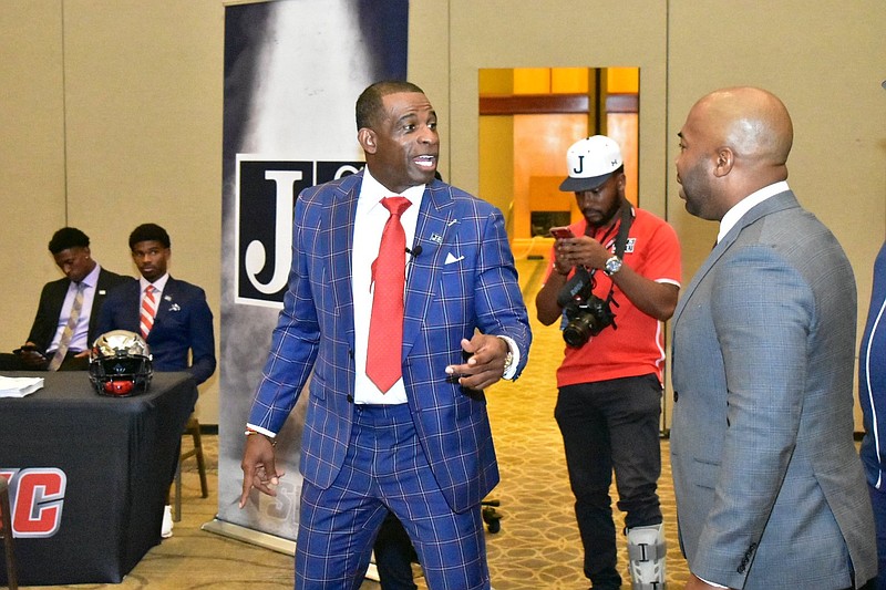 Jackson State Coach Deion Sanders converses Tuesday before the start of the SWAC Media Day in Birmingham, Ala. 
(Pine Bluff Commercial/I.C. Murrell)