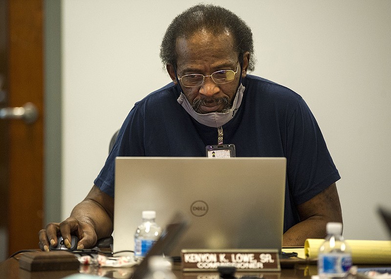 Kenyon Lowe, Sr., Chairman of the Board of Commissioners for the City of Little Rock Housing Authority D/B/A Metropolitan Housing Alliance, checks his computer at the start of a Special Call board meeting on Tuesday, July 20, 2021. (Arkansas Democrat-Gazette/Stephen Swofford)