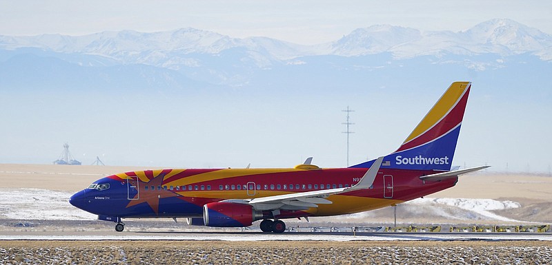 A Southwest Airlines jetliner taxis for takeoff in Denver in this December file photo. Southwest said Thursday, that it posted a quarterly profi t of $348 million, including $724 million in federal help. Video available at arkansasonline.com/723fl ights/.
(AP)