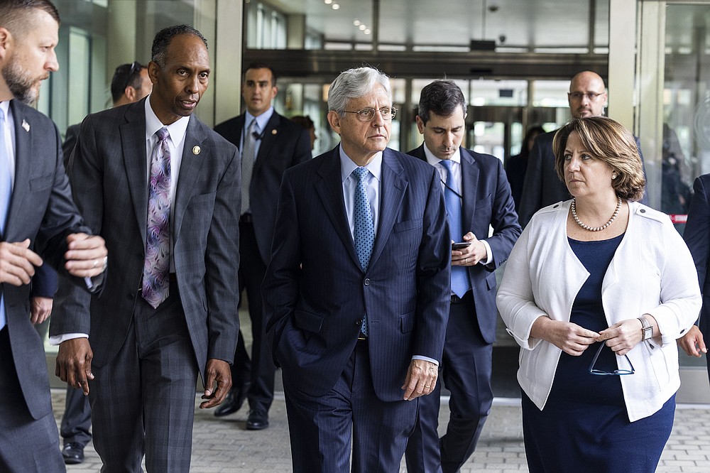 Attorney General Merrick Garland (center) leaves the Bureau of Alcohol, Tobacco Firearms and Explosives headquarters Thursday in Washington with ATF acting Director Marvin Richardson and Deputy Attorney General Lisa Monaco after announcing gun crime “strike forces” for five major areas of the country. “This is not a short-term infusion of resources, rather it’s a long-term, coordinated, multijurisdictional strategy,” a Justice Department official said.
(AP/Jim Lo Scalzo)