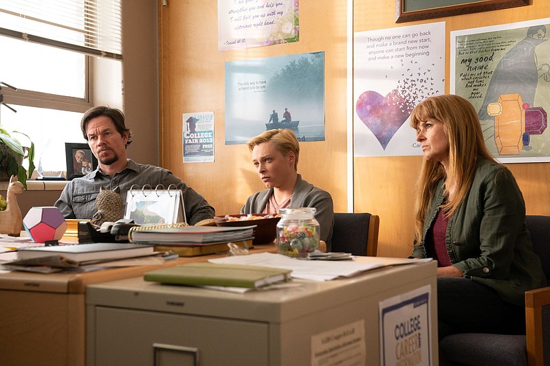 The Bell family, father Joe (Mark Wahlberg), son Jadin (Reid Miller) and mother Lola (Connie Britton) consult with school officials on how to solve a bullying problem in Reinaldo Marcus Green’s “Joe Bell.”