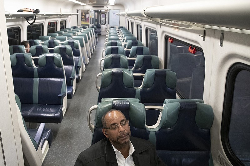 A commuter sits in an otherwise empty car as he waits for an evening train to leave Grand Central Terminal in New York. The pandemic caused the number of people working from home to rise from 22% in 2019 to 42% in 2020.
(AP)